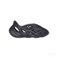 ADIDAS YEEZY FOAM RNR ONYX, a sleek black slip-on sneaker made from EVA foam with oval cutouts.