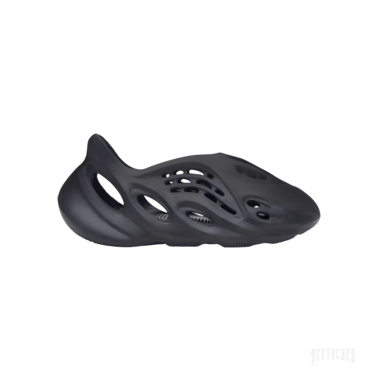 ADIDAS YEEZY FOAM RNR ONYX, a sleek black slip-on sneaker made from EVA foam with oval cutouts.