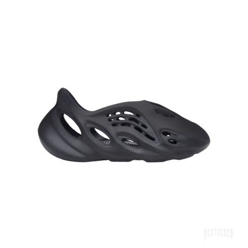 ADIDAS YEEZY FOAM RNR ONYX, a sleek black slip-on sneaker made from EVA foam with oval cutouts.
