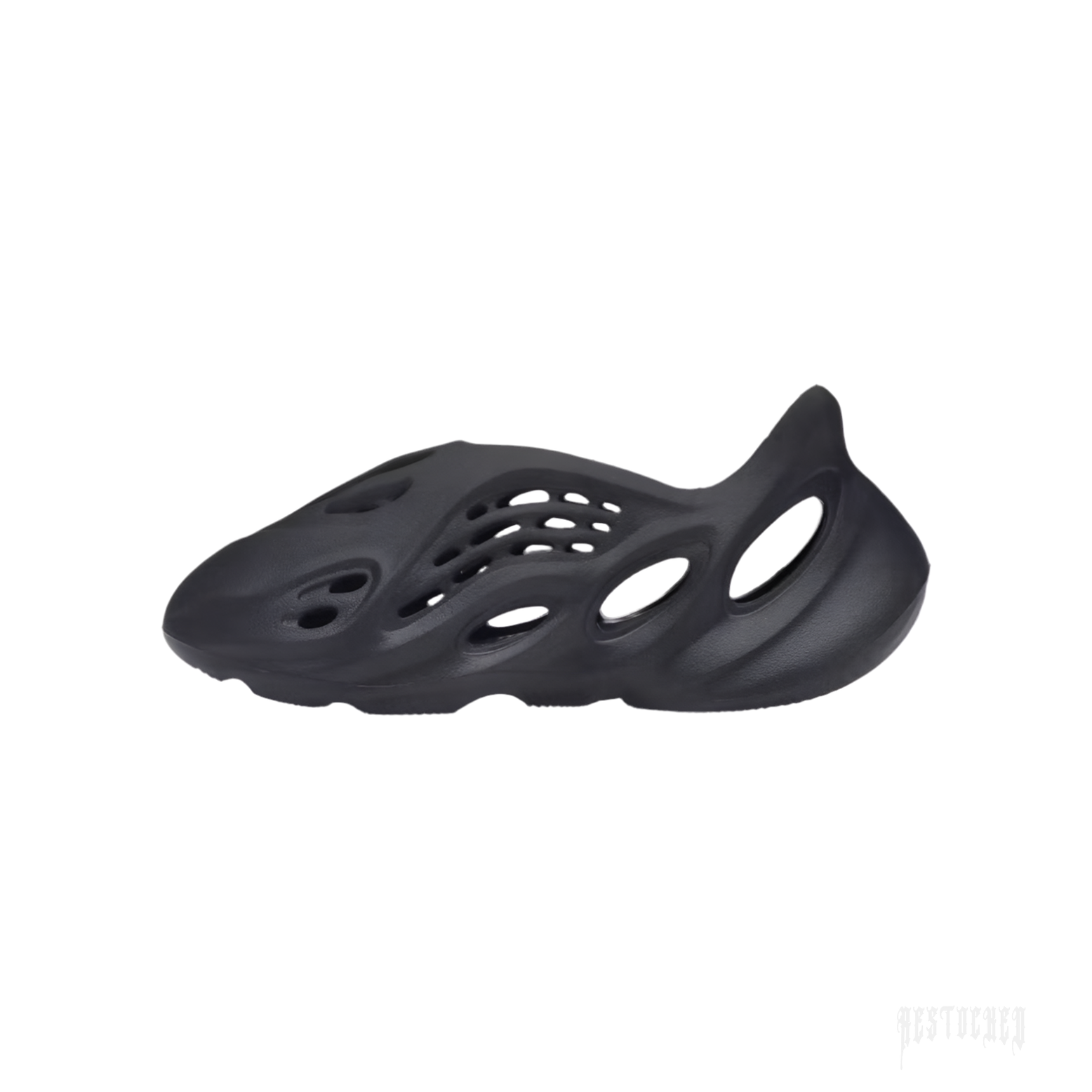 ADIDAS YEEZY FOAM RNR ONYX slip-on sneaker, black EVA foam with oval cutouts and sculptural sole.