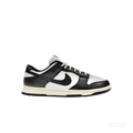 NIKE DUNK LOW VINTAGE PANDA women's sneaker, black and white leather, side view, cream laces and sole.