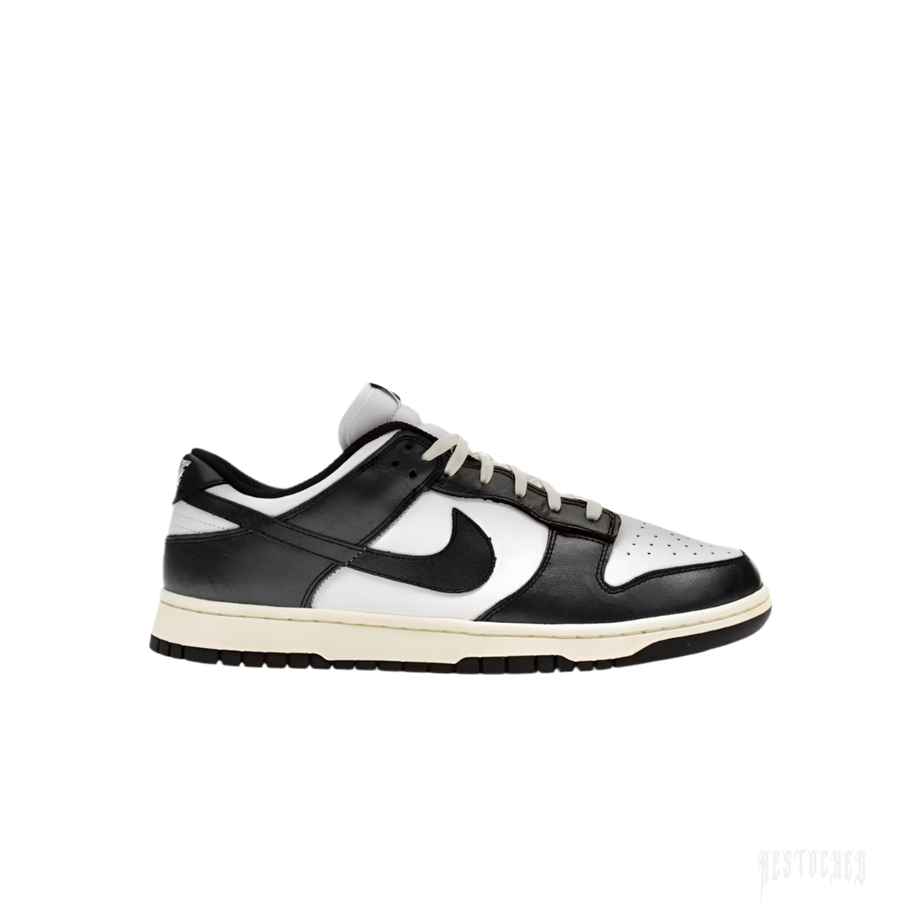 NIKE DUNK LOW VINTAGE PANDA women's sneaker, black and white leather, side view, cream laces and sole.