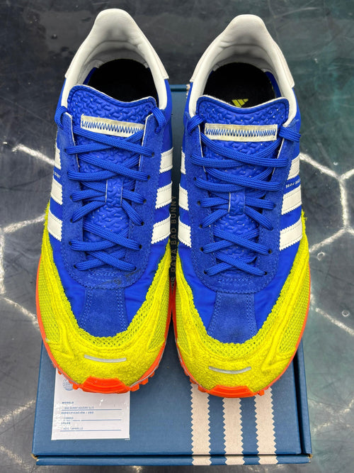 ADIDAS ADIZERO SL 72 Bad Bunny Blue Pre-Owned Size 9 sneakers with yellow accents and orange soles.