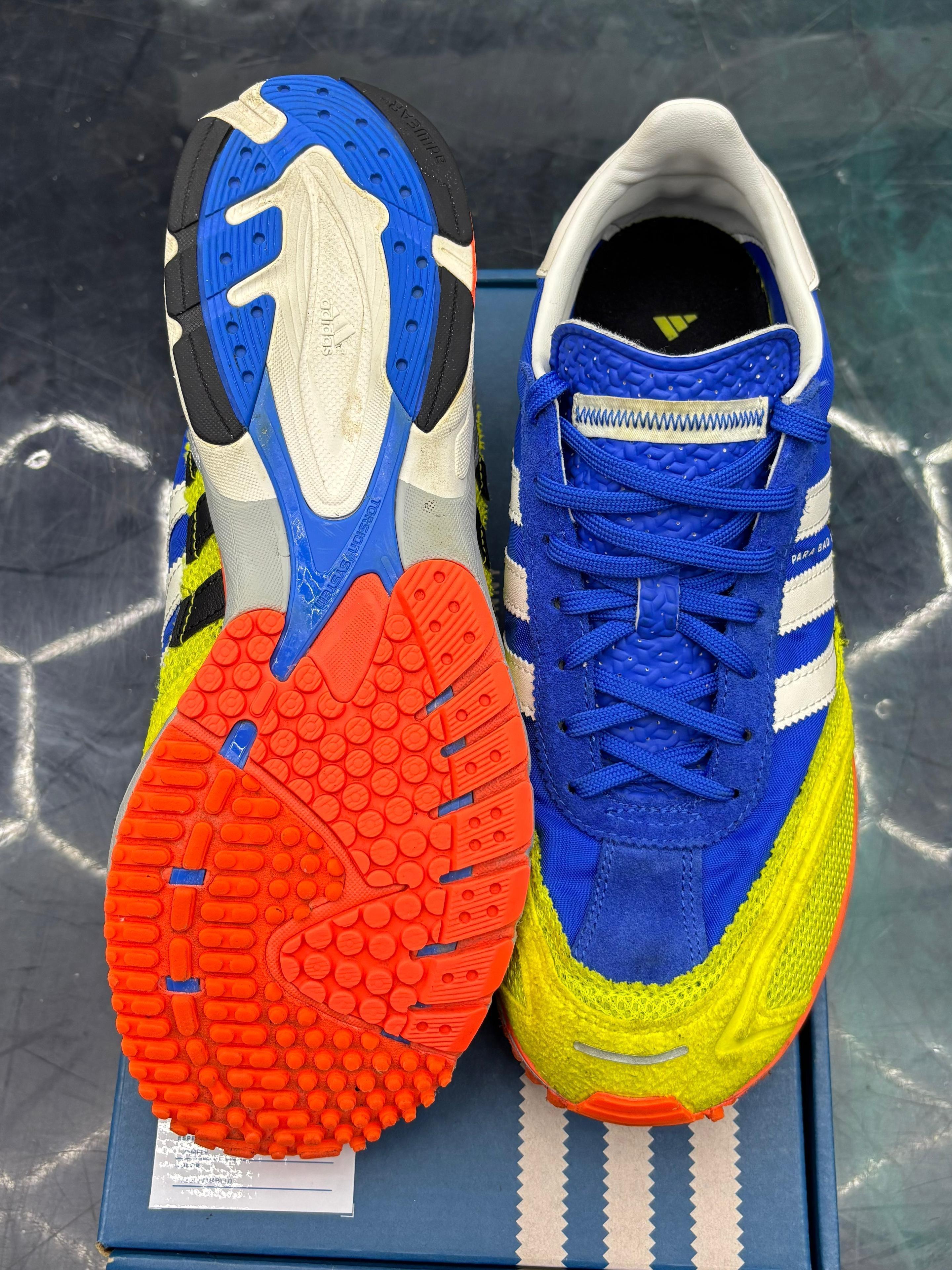 ADIDAS ADIZERO SL 72 Bad Bunny Blue Pre-Owned Size 9, with vibrant blue suede, neon yellow mesh, white stripes, and bright orange outsole.