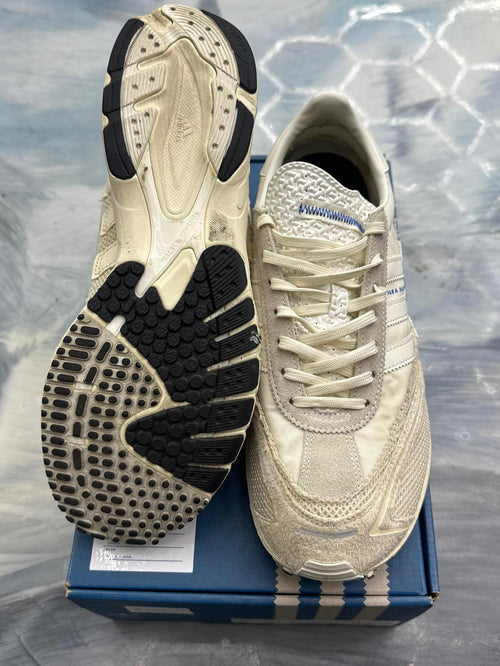 Pre-owned ADIDAS ADIZERO SL 72 Bad Bunny Off White sneakers, size 9.5, showing cream uppers and black outsoles.