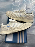 ADIDAS ADIZERO SL 72 Bad Bunny Off White sneakers, size 9.5, with blue accents and mesh details.
