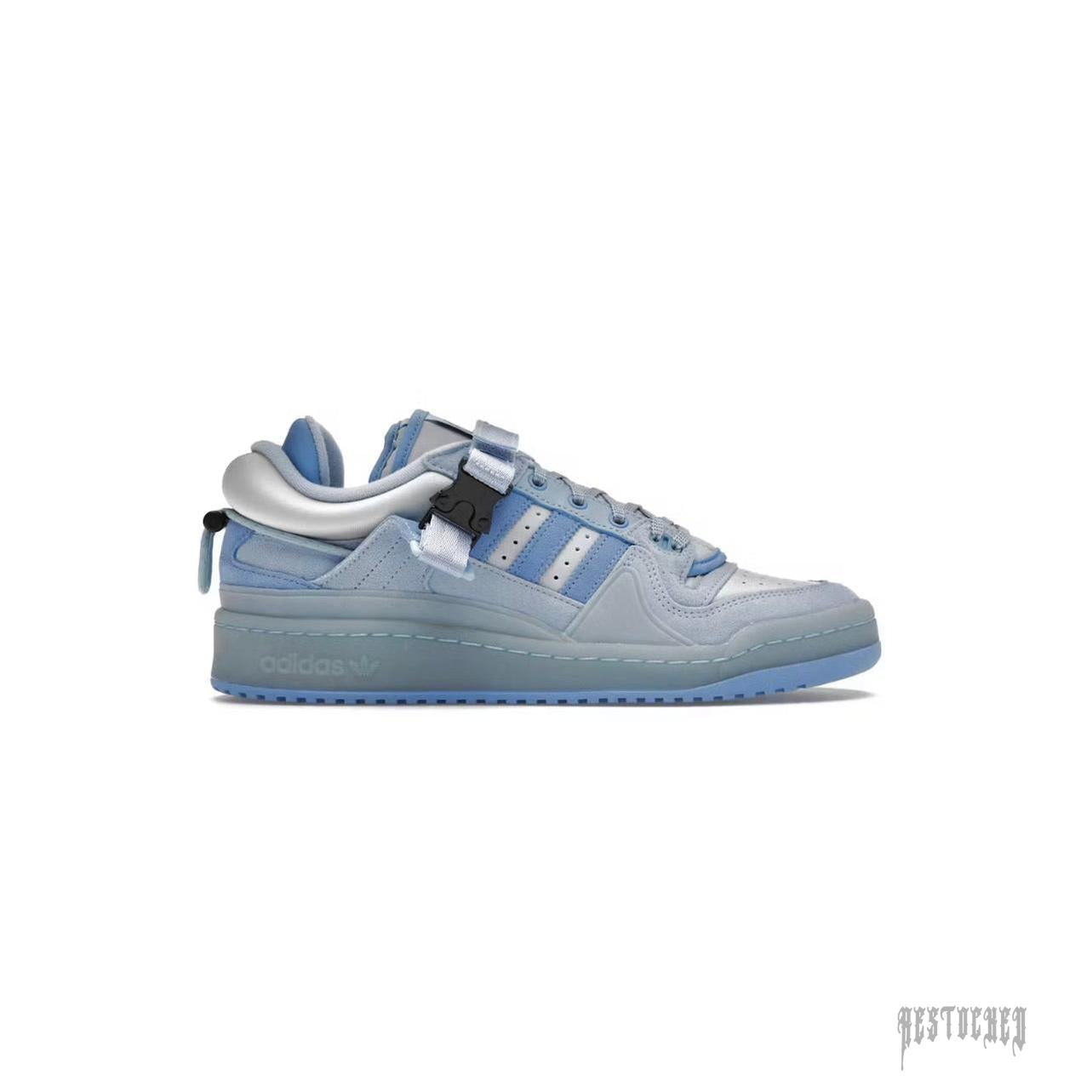 Adidas Forum Buckle Low Bad Bunny Blue Tint sneaker with light blue leather, suede, and a black buckle strap.