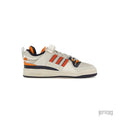 Bad Bunny x adidas Forum Buckle Low "Cangrejeros de Santurce" sneaker, off-white leather with orange and navy accents.