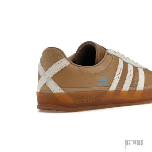 Adidas Gazelle Indoor Bad Bunny Messi "La Voz De Los Fans" brown leather sneaker with white stripes and gum sole.