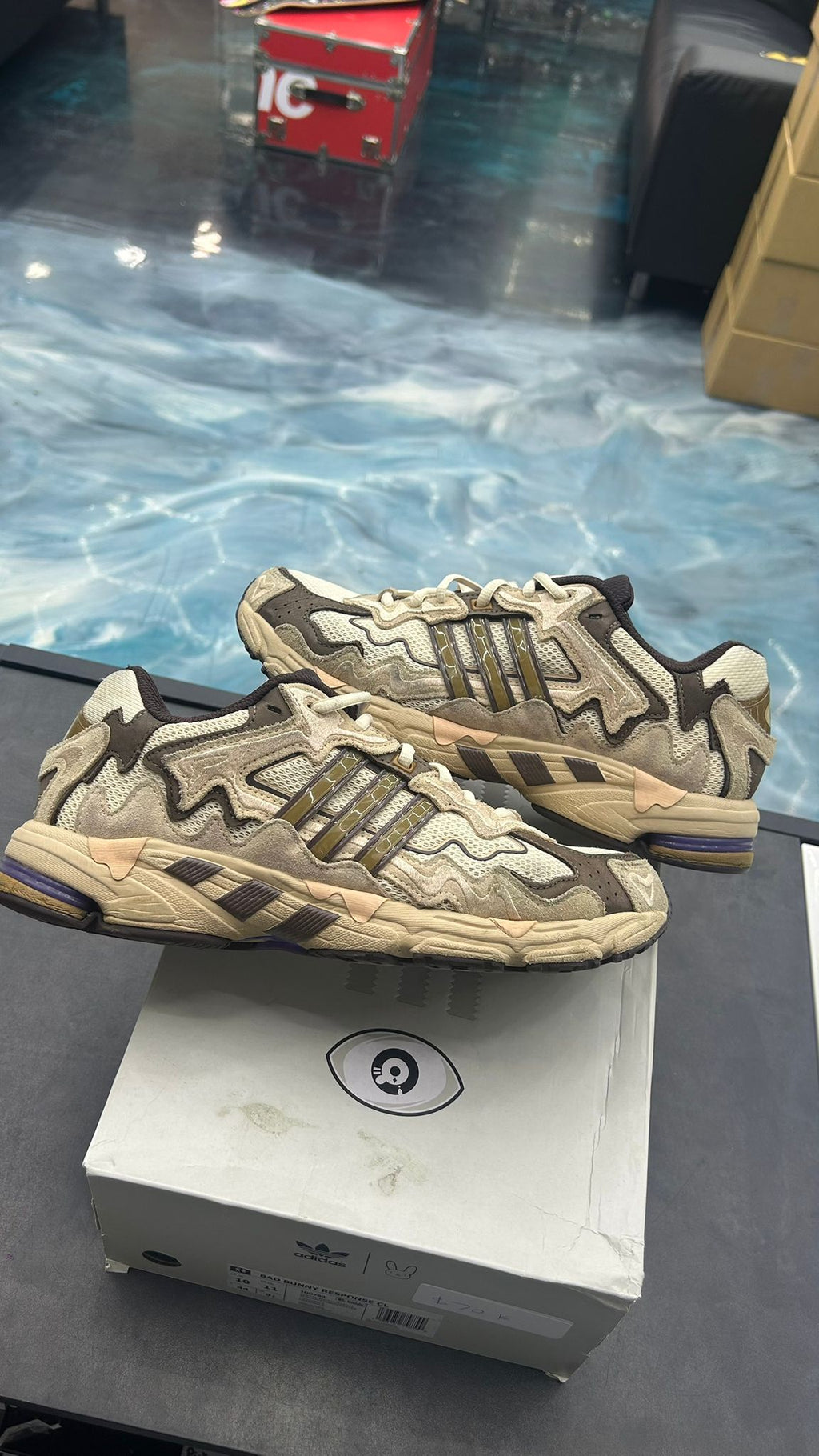 Adidas Response CL Bad Bunny Paso Fino sneakers, pre-owned size 10, in earthy tones with wavy overlays.