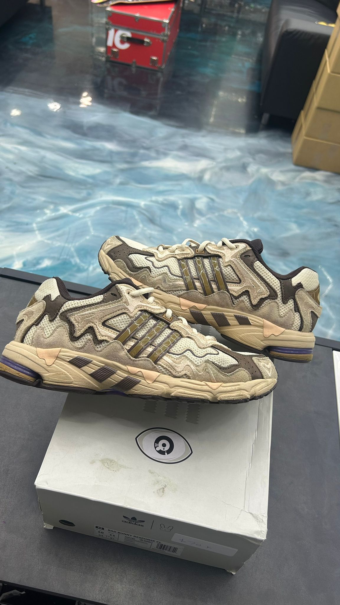 Adidas Response CL Bad Bunny Paso Fino sneakers, pre-owned size 10, in earthy tones with wavy overlays.