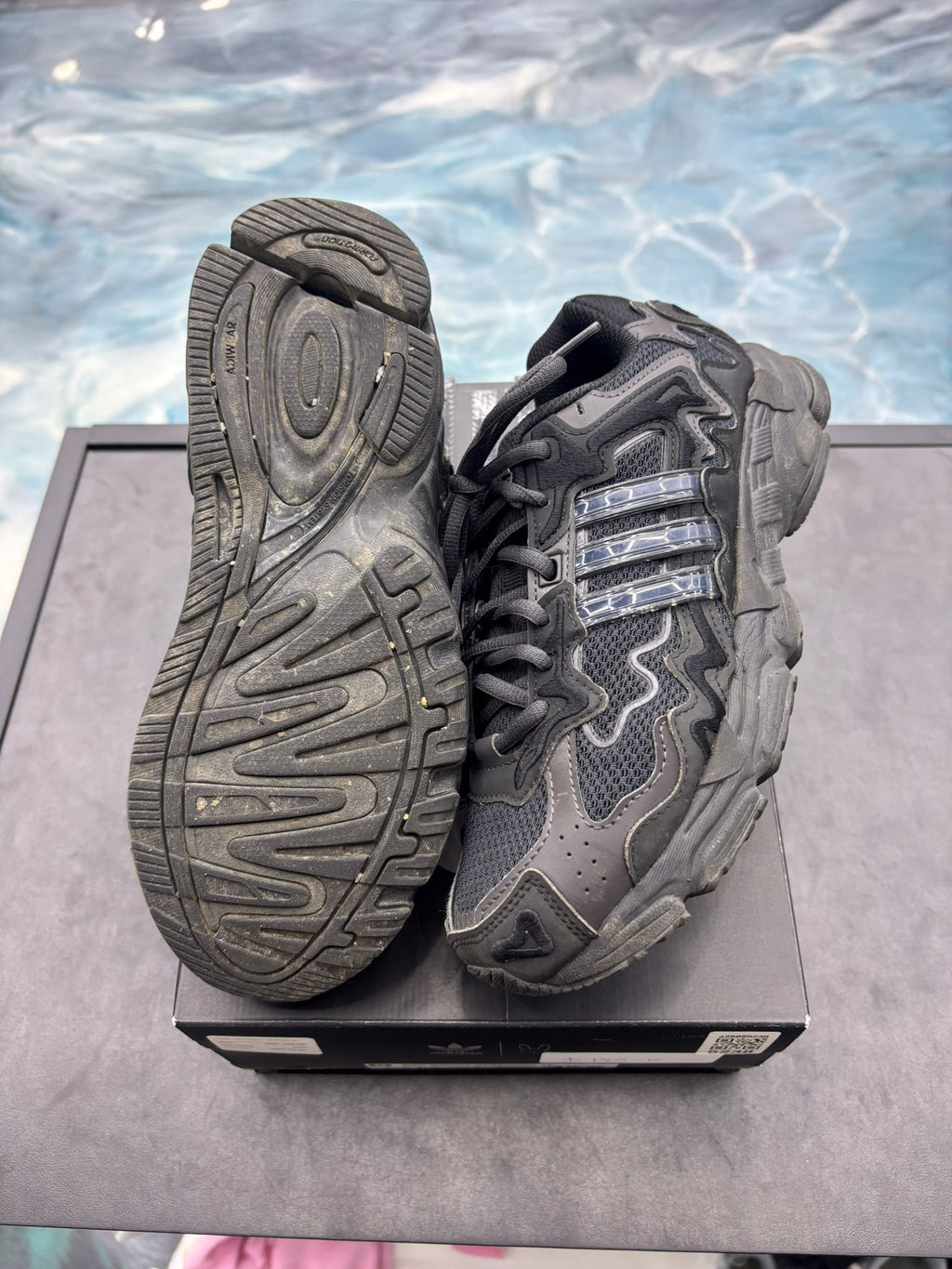 Pre-owned Adidas Response CL Bad Bunny Triple Black size 7 sneakers, showing textured soles and mesh/leather upper.