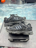 Pre-owned Adidas Response CL Bad Bunny Triple Black sneakers, size 7, with wavy overlays and shiny stripes.
