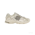 Adidas Response CL Bad Bunny "Wonder White" sneaker, light beige and off-white with dark gray stripes.