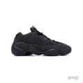 Adidas Yeezy 500 Utility Black sneaker, featuring a sleek all-black mesh and suede design with a chunky sole.