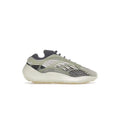 ADIDAS YEEZY 700 V3 FADE SALT sneaker with a light grey and black upper, translucent cage, and cream sole.