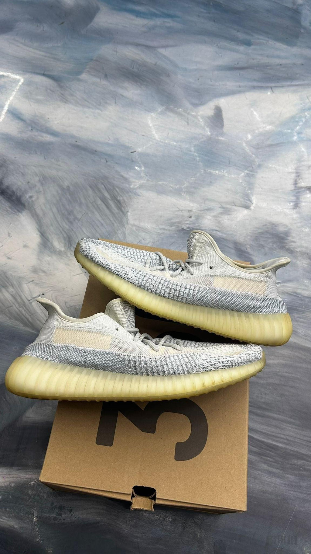 Pre-owned ADIDAS YEEZY BOOST 350 Cloud White sneakers, size 11.5, with Primeknit upper and translucent yellow Boost sole.