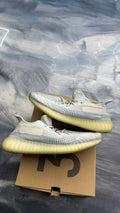 Pre-owned ADIDAS YEEZY BOOST 350 Cloud White sneakers, size 11.5, with Primeknit upper and translucent yellow Boost sole.
