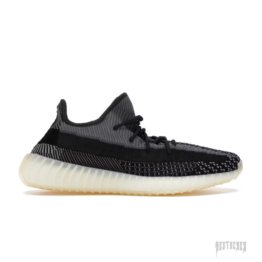 ADIDAS YEEZY BOOST 350 V2 CARBON sneaker, dark grey and black Primeknit upper, translucent cream sole.