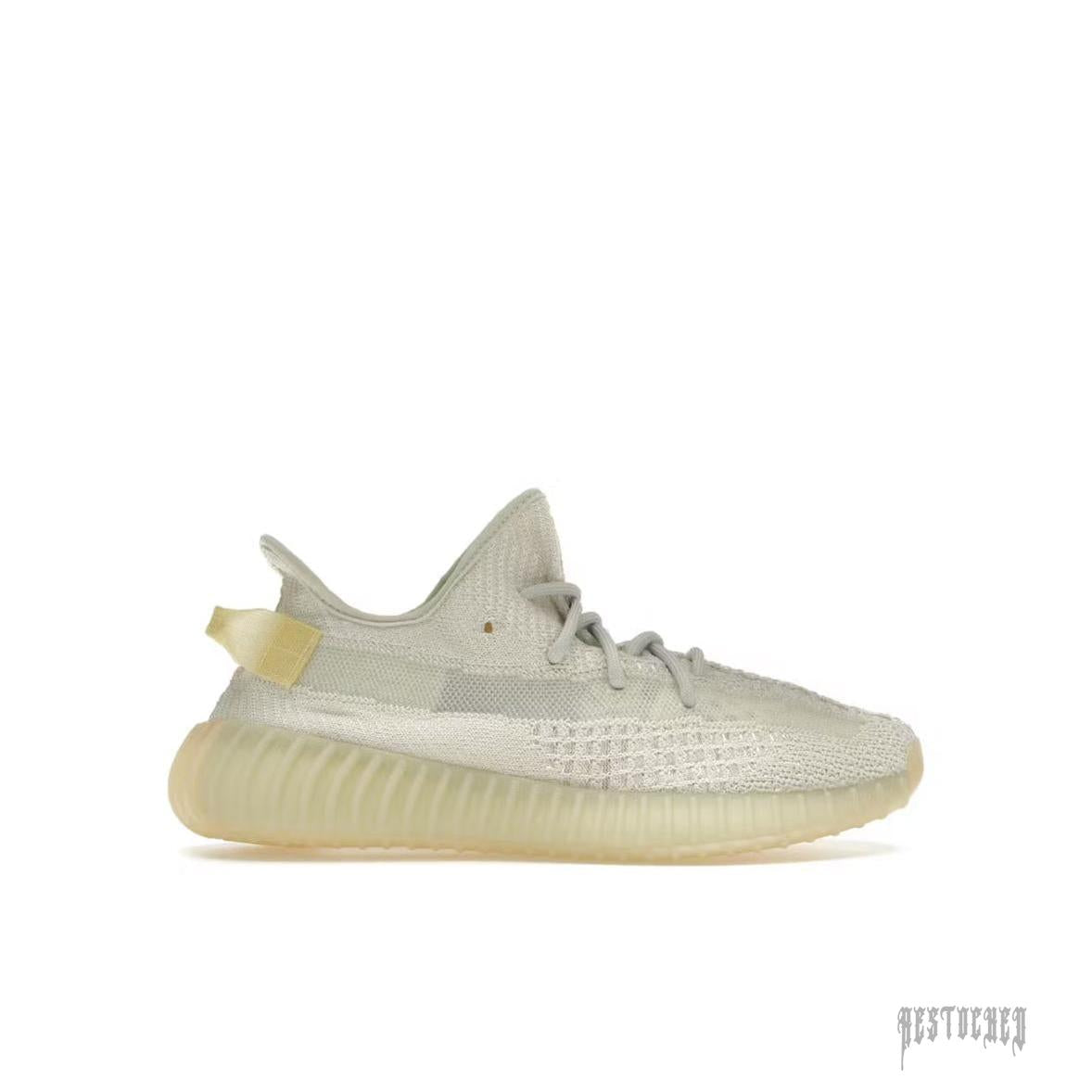 ADIDAS YEEZY BOOST 350 V2 LIGHT sneaker, light grey Primeknit upper, translucent sole, and heel tab.