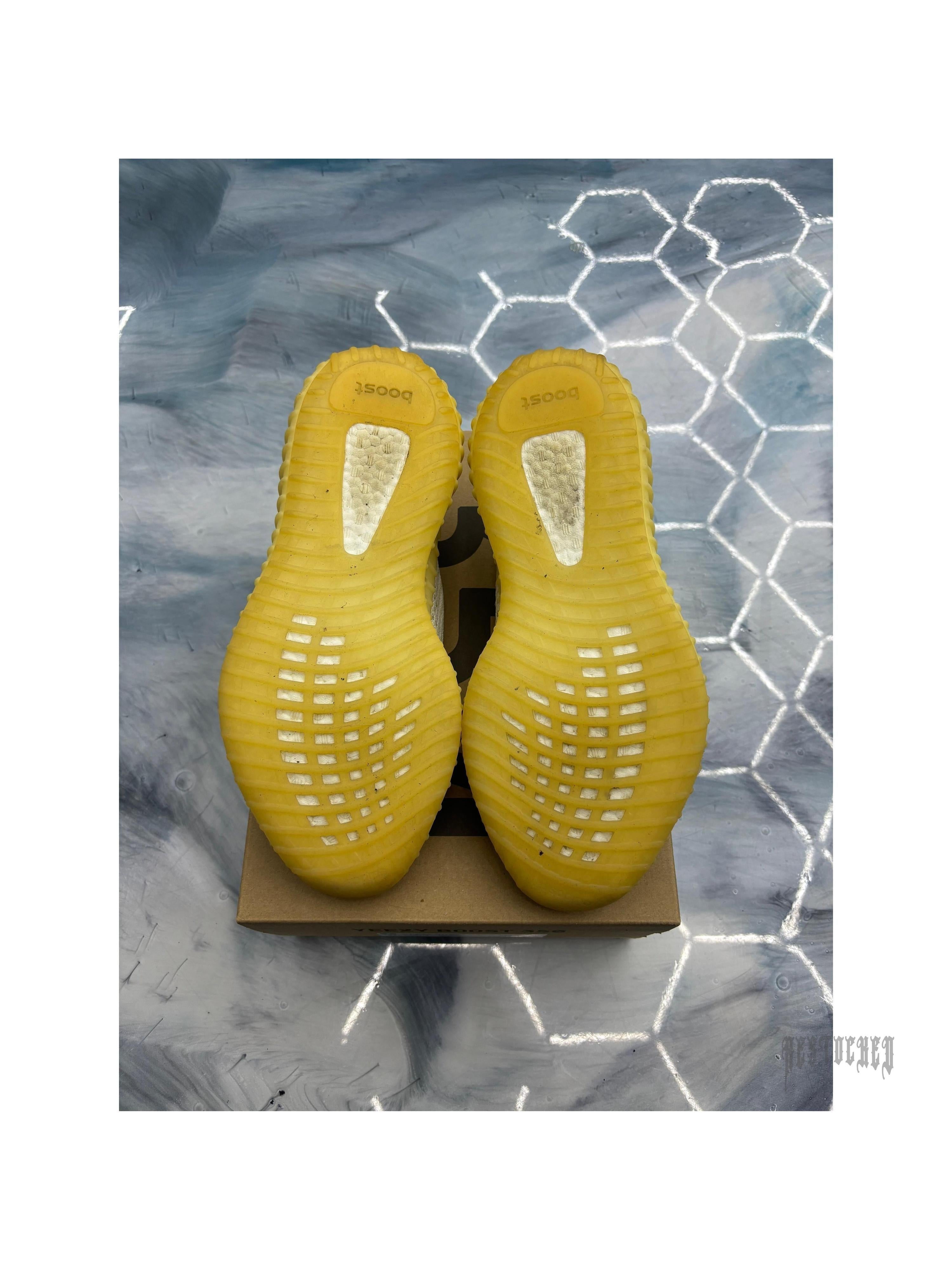 Pre-owned ADIDAS YEEZY BOOST 350 V2 Natural sneakers, size 11, showing yellow ribbed outsoles.