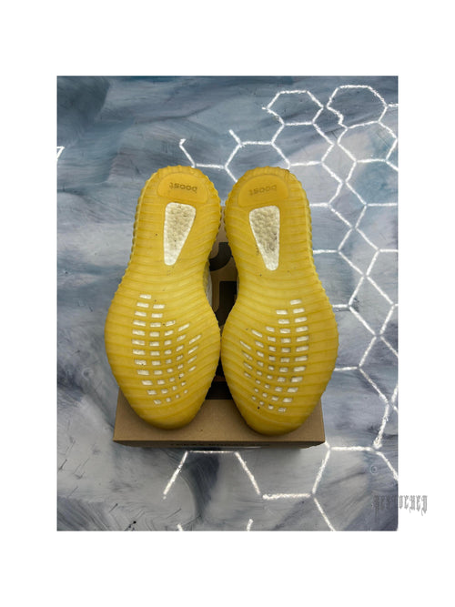 Pre-owned ADIDAS YEEZY BOOST 350 V2 Natural sneakers, size 11, showing yellow ribbed outsoles.