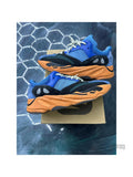 Pre-owned ADIDAS YEEZY BOOST 700 Bright Blue sneakers, size 11.5, with orange soles.