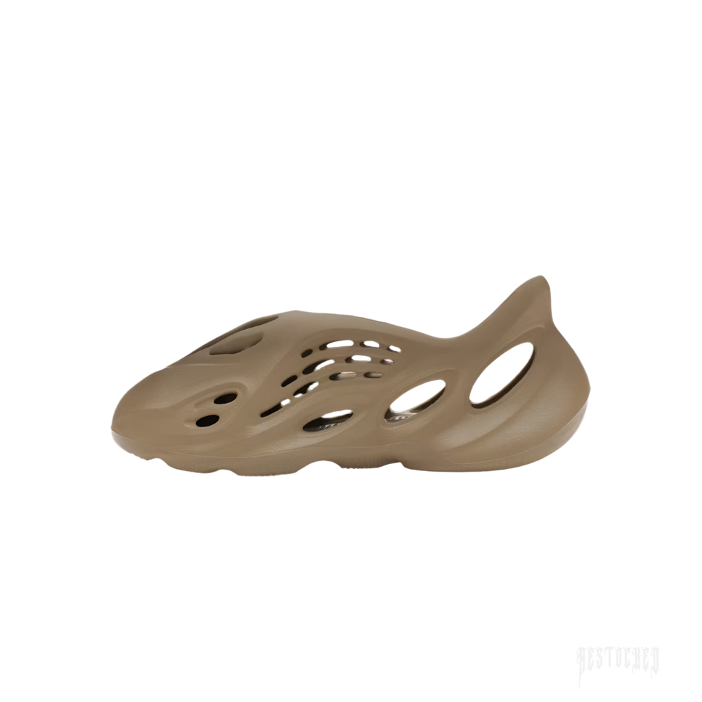 ADIDAS YEEZY FOAM RNR STONE TAUPE, a single taupe-colored foam clog with an open-cell design.