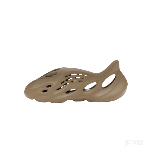 ADIDAS YEEZY FOAM RNR STONE TAUPE, a single taupe-colored foam clog with an open-cell design.