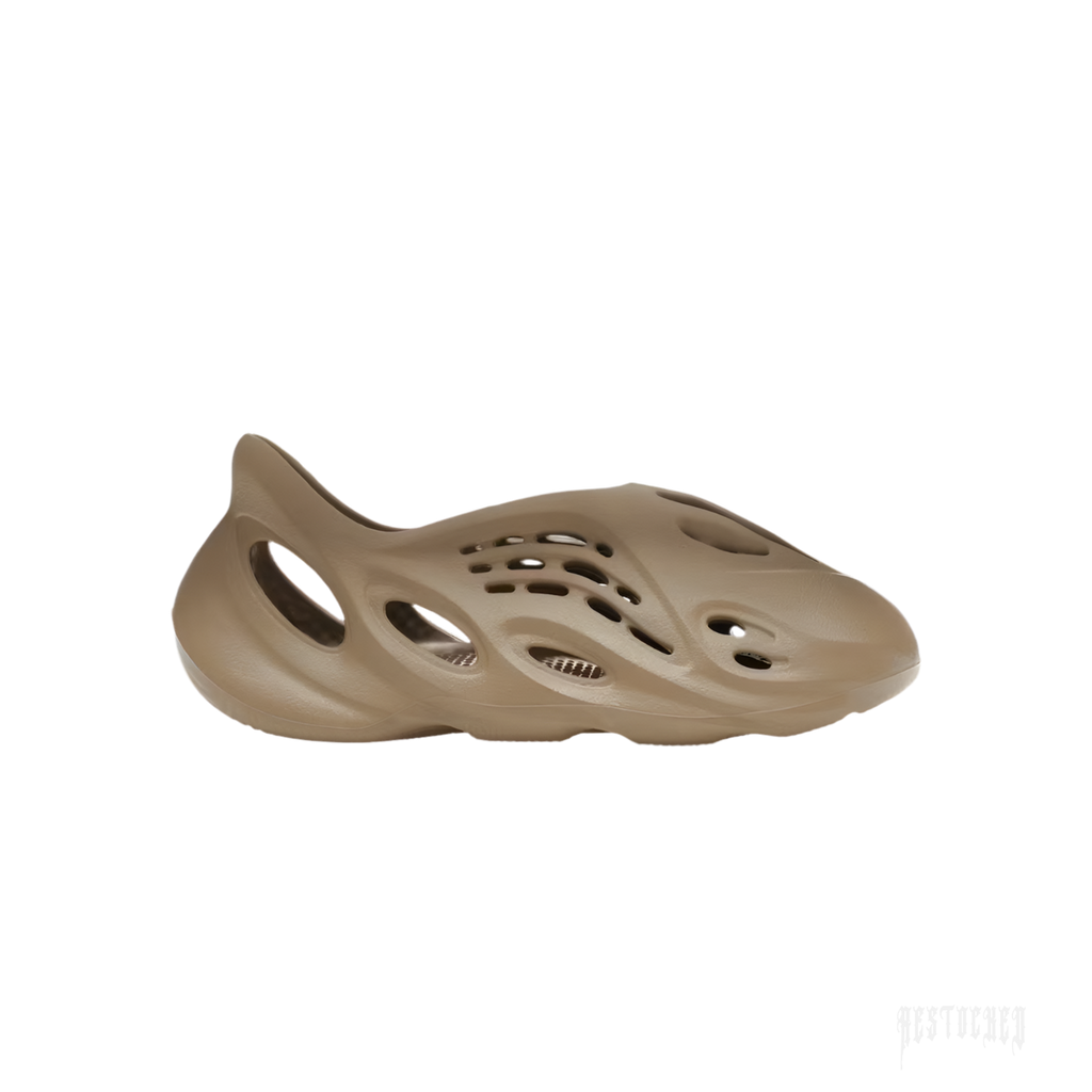 ADIDAS YEEZY FOAM RNR STONE TAUPE, a single taupe-colored foam clog with an ergonomic, perforated design.