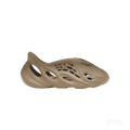ADIDAS YEEZY FOAM RNR STONE TAUPE, a single taupe-colored foam clog with an ergonomic, perforated design.