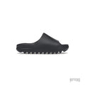 ADIDAS YEEZY SLIDE in Slate Grey, made from lightweight EVA foam with a minimalist design and serrated sole.