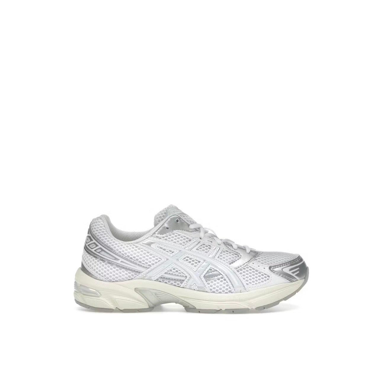 ASICS GEL-1130 women's sneaker in white mesh with silver metallic overlays and blue fade accents.