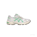 ASICS GEL-1130 women's sneaker with white mesh, Malachite Green accents, and off-white midsole.