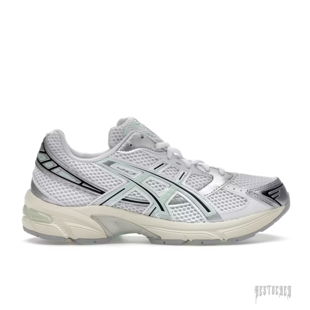 ASICS GEL 1130 sneaker in white mesh with silver and mint tint accents, black stripes, and a cream sole.