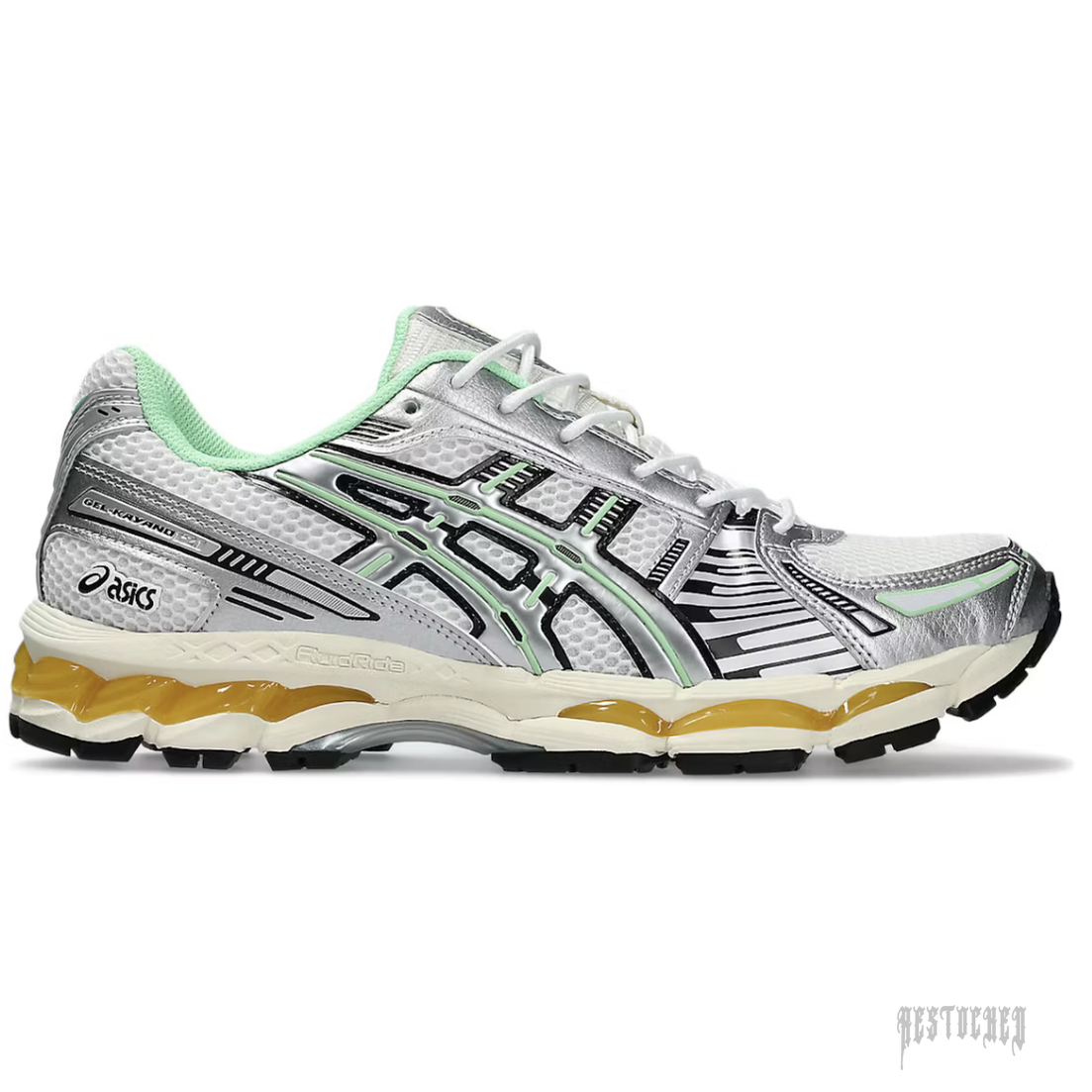 ASICS GEL KAYANO 12.1 in silver, white mesh, green accents, and orange FluidRide sole.