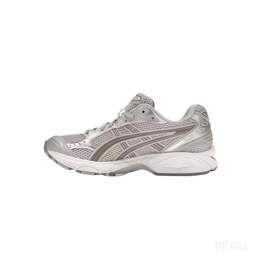 ASICS GEL-KAYANO 14 Cloud Grey sneaker, side view. Features breathable mesh, metallic silver overlays, and white sole.