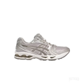 ASICS GEL-KAYANO 14 Cloud Grey sneaker, side view, with metallic silver overlays and mesh upper.