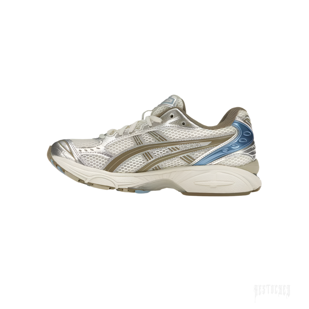 ASICS GEL-KAYANO 14 "Cream/Pepper" women's sneaker with layered mesh, synthetic leather, and blue accents.