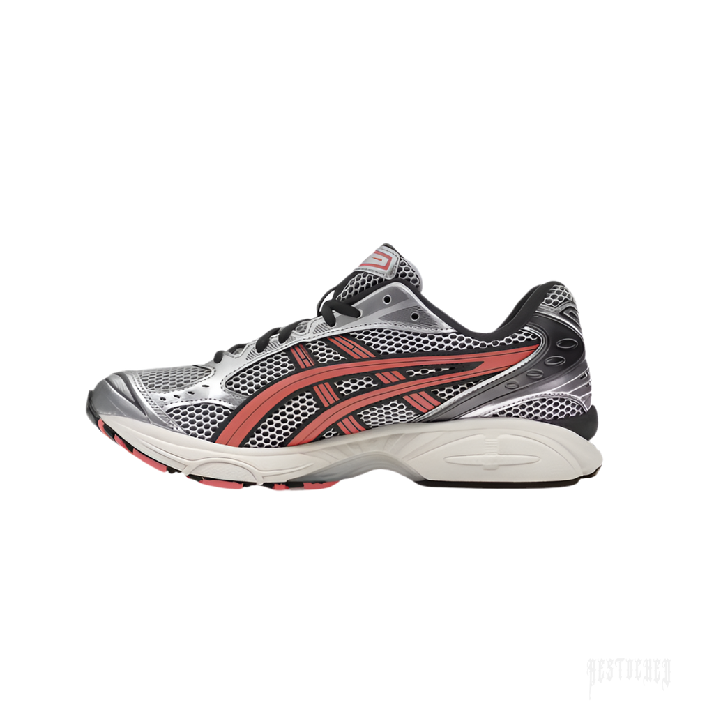 ASICS GEL-KAYANO 14 sneaker in silver mesh with papaya stripes and black accents.