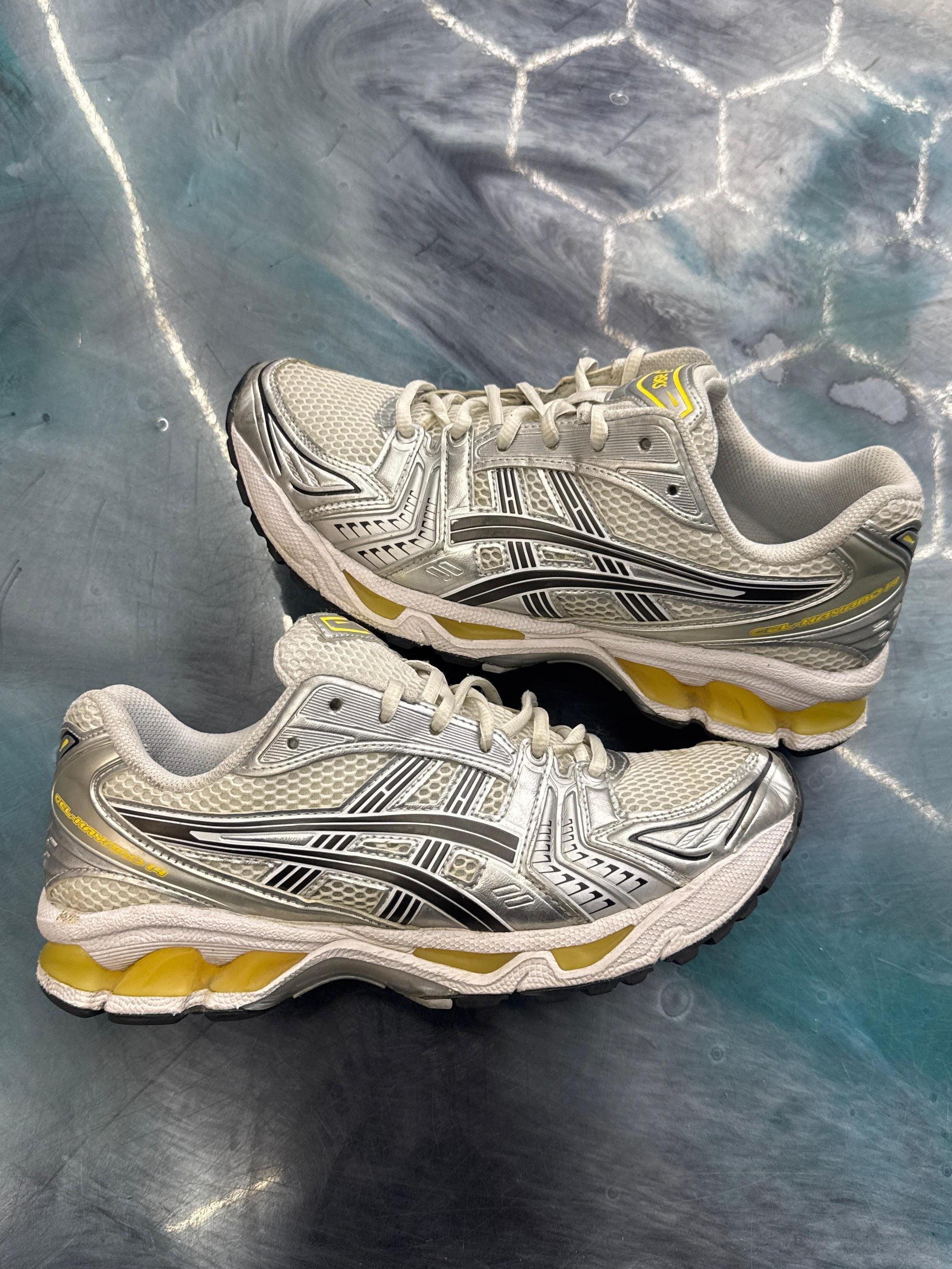 ASICS GEL KAYANO 14 Tai Chai Yellow pre-owned size 8.5 sneakers with silver mesh and yellow soles.