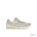 ASICS GEL-KAYANO 14 women's sneaker in white and smoke grey with mesh and suede details.