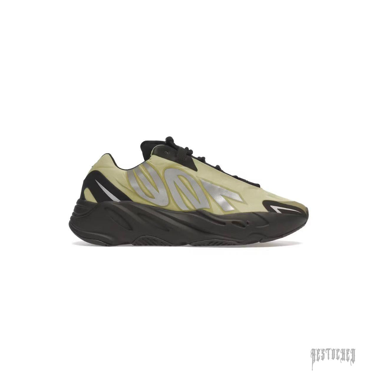 Adidas Yeezy Boost 700 MNVN Resin sneaker with a light green nylon upper, black sole, and reflective silver "700" branding.