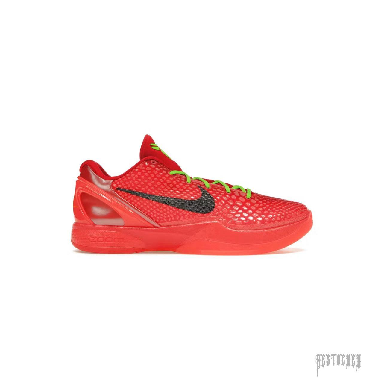 NIKE KOBE 6 PROTRO REVERSE GRINCH red basketball shoe with black swoosh and lime green laces.
