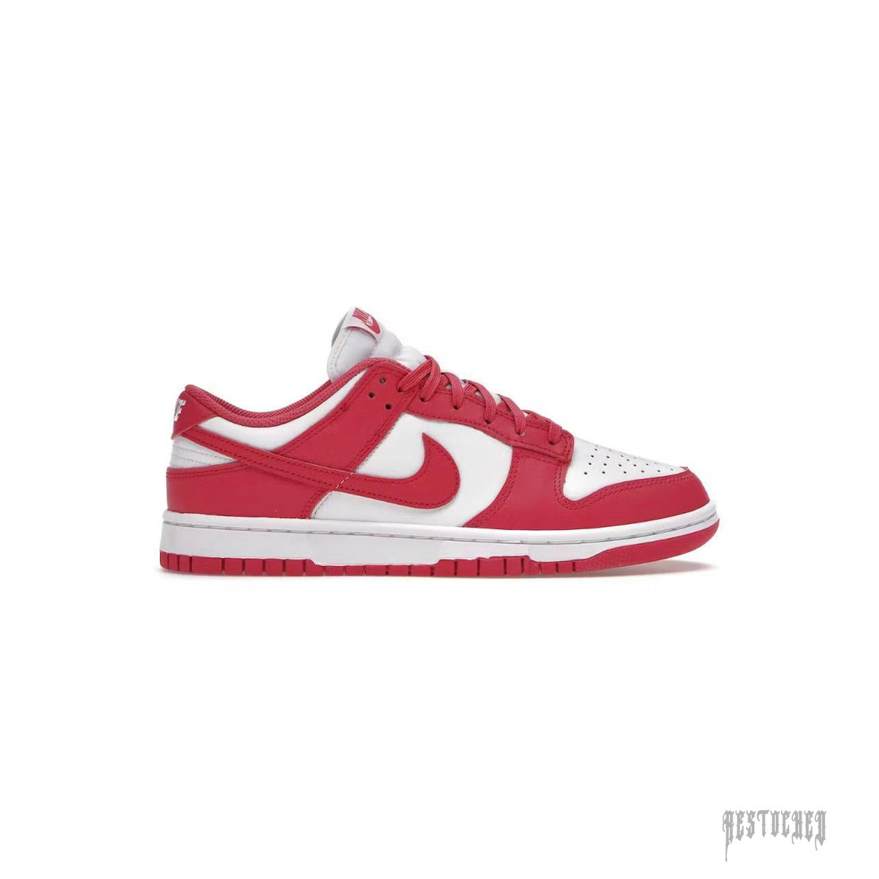 Nike Dunk Low Archeo Pink women's sneaker with white leather upper and pink accents.