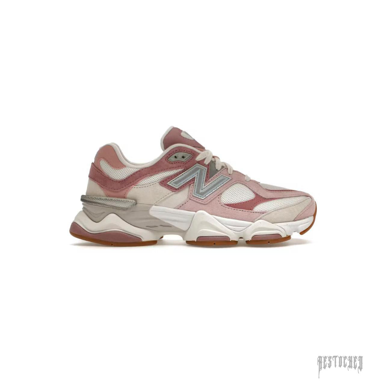 New Balance 9060 Rose Pink sneaker with white mesh, pink suede overlays, and silver 'N' logo.