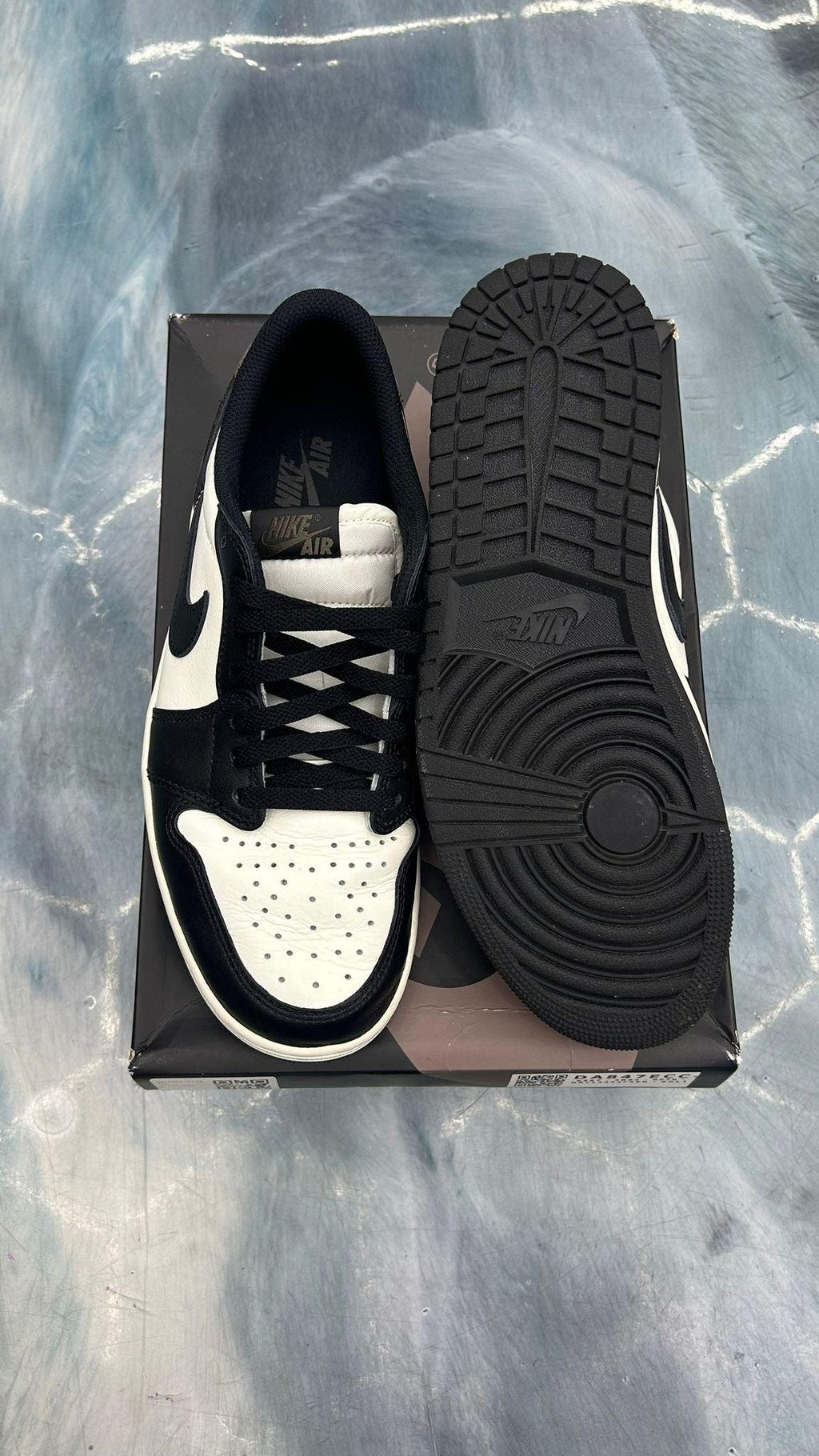 Pre-owned Jordan 1 Low Retro Mocha size 10, black and white leather sneakers with black laces.