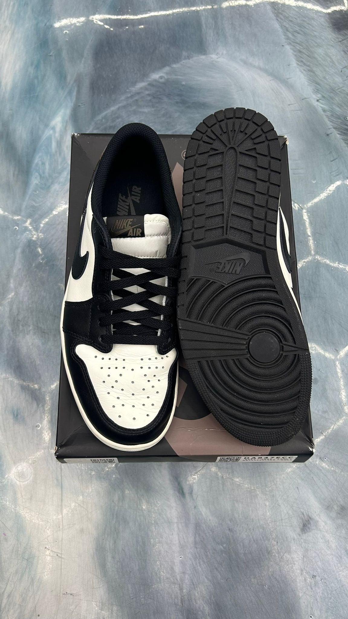 Pre-owned Jordan 1 Low Retro Mocha size 10, black and white leather sneakers with black laces.