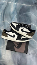 Pre-owned Jordan 1 Low Retro Mocha sneakers, black and white leather with dark brown suede accents, size 10.