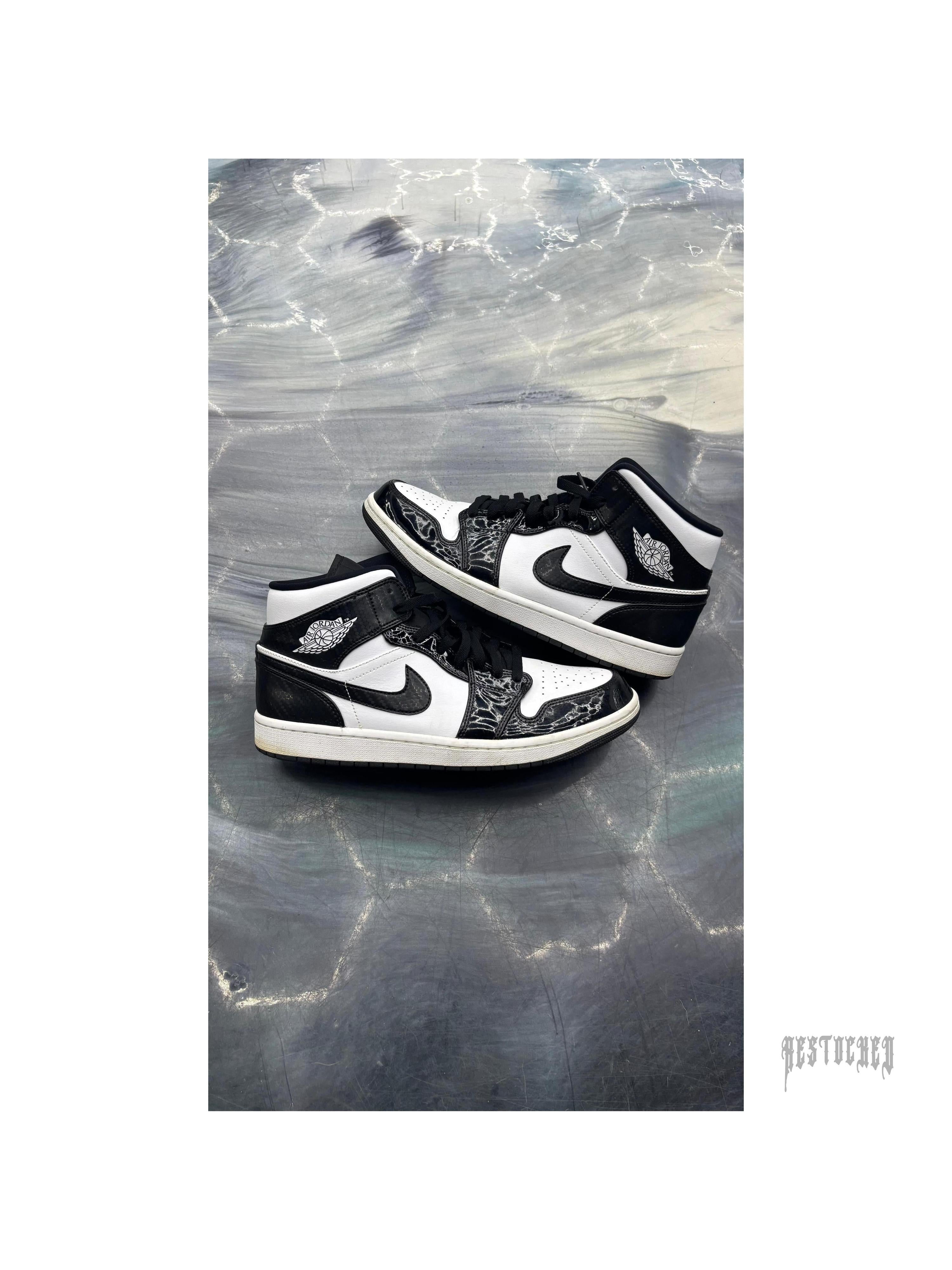 Pre-owned Jordan 1 Mid Carbon Fiber sneakers, black and white, size 11, with textured details.
